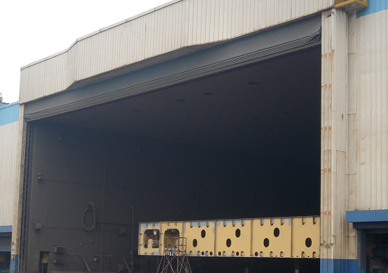 Large enclosures with heating systems are commonly used for maintaining environmental conditions for painting. Direct-fired heating of those enclosures presents complications for amine-cured coatings.